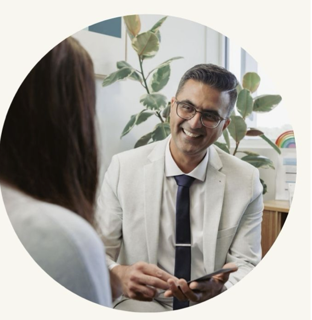 Dr Nikhil Patravali in consultation with a patient